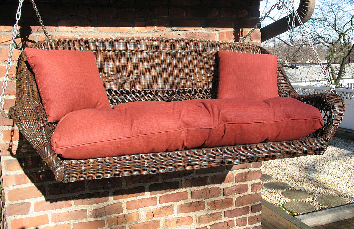 White wicker store porch swing